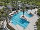 Expansive community pool area with lap lanes, sunbathing areas, and lush landscaping for resort-style living at 2929 Bluestem Ln, Clermont, FL 34714
