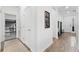 Hallway showcasing modern decor and adjacent room with bunk beds at 2929 Bluestem Ln, Clermont, FL 34714