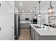 Kitchen featuring stainless steel appliances, granite counters, and an island with bar stool seating at 2929 Bluestem Ln, Clermont, FL 34714