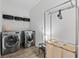 Laundry room featuring modern appliances and ample shelving space at 2929 Bluestem Ln, Clermont, FL 34714