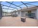 Screened-in patio features brick flooring, spa and provides ample space for outdoor entertainment at 2929 Bluestem Ln, Clermont, FL 34714