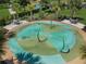 Aerial shot of a splash pad featuring multiple sprinklers and seating, perfect for cooling off on hot days at 2929 Bluestem Ln, Clermont, FL 34714