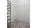Spacious walk-in closet featuring wire shelving and plush gray carpeting at 2929 Bluestem Ln, Clermont, FL 34714