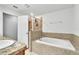 Bathroom featuring a soaking tub and a separate walk-in shower at 3256 Rodrick Cir, Orlando, FL 32824