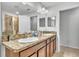 Bathroom featuring double sinks and granite countertops at 3256 Rodrick Cir, Orlando, FL 32824