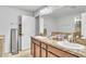 Bathroom with double sinks, granite countertops, and custom cabinets at 3256 Rodrick Cir, Orlando, FL 32824