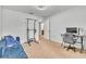 Spacious room featuring a futon, desk, and access to another room at 3256 Rodrick Cir, Orlando, FL 32824