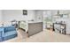 Bedroom with a seating area, large window and neutral carpeting at 3256 Rodrick Cir, Orlando, FL 32824