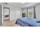 Bedroom featuring a closet, large window, and neutral carpeting at 3256 Rodrick Cir, Orlando, FL 32824