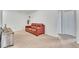 Cozy bonus room with neutral carpet, a leather sofa, and a closet at 3256 Rodrick Cir, Orlando, FL 32824
