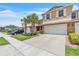 Well-maintained townhome with a two-car garage, mature landscaping, and inviting curb appeal at 3256 Rodrick Cir, Orlando, FL 32824