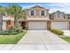 Inviting two-story townhome featuring a spacious two car garage and well-maintained landscaping at 3256 Rodrick Cir, Orlando, FL 32824