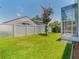 Large backyard with a well-maintained lawn, and a screened lanai at 3713 Becontree Pl, Oviedo, FL 32765