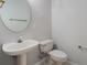 Half bathroom featuring a pedestal sink, and a toilet at 3713 Becontree Pl, Oviedo, FL 32765