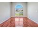 Bedroom with hardwood floors and a large window offering natural light at 3713 Becontree Pl, Oviedo, FL 32765