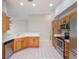 Bright kitchen with stainless steel appliances, ample cabinetry, and sleek countertops at 3713 Becontree Pl, Oviedo, FL 32765