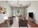 Comfortable living area with sliding glass doors offering natural light and views of the outdoor patio at 3713 Becontree Pl, Oviedo, FL 32765