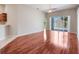 Open living area with hardwood floors and access to the patio at 3713 Becontree Pl, Oviedo, FL 32765
