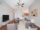 Spacious living area with hardwood floors, comfortable seating, and an open layout perfect for modern living at 3713 Becontree Pl, Oviedo, FL 32765
