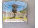 Covered patio with screen enclosure overlooking the backyard and blue sky at 3713 Becontree Pl, Oviedo, FL 32765