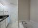 Bright bathroom featuring a tub, vanity, and clean tile flooring at 3891 Sagefield Dr, Harmony, FL 34773