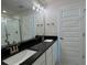 Modern bathroom featuring double sinks, a large mirror, and walk-in shower at 3891 Sagefield Dr, Harmony, FL 34773