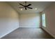 Spacious bedroom features new carpet, a ceiling fan, and a bright window at 3891 Sagefield Dr, Harmony, FL 34773