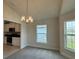 Bright dining area with views into the kitchen, featuring modern appliances at 3891 Sagefield Dr, Harmony, FL 34773