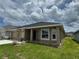 Beautiful single-story home featuring neutral paint, a well-manicured lawn, and an inviting entrance at 3891 Sagefield Dr, Harmony, FL 34773