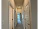 Hallway with doors and natural light at 3891 Sagefield Dr, Harmony, FL 34773