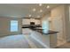 Stylish kitchen with stainless steel appliances, an island, and granite countertops at 3891 Sagefield Dr, Harmony, FL 34773