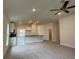 Spacious living room with an island and ceiling fan featuring ample natural light at 3891 Sagefield Dr, Harmony, FL 34773