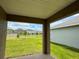 View from the covered patio to the large, lush backyard of this lovely home at 3891 Sagefield Dr, Harmony, FL 34773