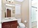 Cozy bathroom with a marble vanity, toilet, window, and shower/tub combination providing all bathroom essentials at 4123 Oaktree Dr, Davenport, FL 33837
