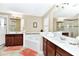 Spacious bathroom with dual sinks, soaking tub, and glass-enclosed shower at 4123 Oaktree Dr, Davenport, FL 33837
