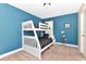 Cozy bedroom with a bunk bed, window, and modern decorations at 4123 Oaktree Dr, Davenport, FL 33837