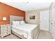 Comfortable bedroom with a stylish bed, soft lighting, and fresh decor for a relaxing retreat at 4123 Oaktree Dr, Davenport, FL 33837