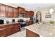 Spacious kitchen features granite counters and stainless steel appliances at 4123 Oaktree Dr, Davenport, FL 33837