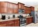 Spacious kitchen features granite counters and stainless steel appliances at 4123 Oaktree Dr, Davenport, FL 33837