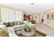 Comfortable living room with plush sectional sofa, decorative pillows and an ottoman coffee table at 4123 Oaktree Dr, Davenport, FL 33837
