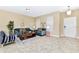 Inviting living space with tiled flooring, comfortable seating, and modern decor, perfect for relaxation at 4123 Oaktree Dr, Davenport, FL 33837