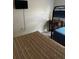 Bedroom featuring bunk beds and twin beds, a mounted TV and simple wall decor at 4529 Alberto Cir, Kissimmee, FL 34746