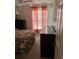 Bedroom featuring a ceiling fan, window with blinds, and dresser at 4529 Alberto Cir, Kissimmee, FL 34746