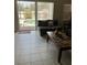 Spacious living area with sliding glass doors leading to outdoor living space with a view of the pool at 4529 Alberto Cir, Kissimmee, FL 34746