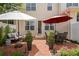 Inviting backyard with patio featuring lounge seating, dining area, and lush landscaping at 4709 Fox St, Orlando, FL 32814