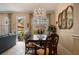 Elegant dining room with a chandelier, and access to outdoor patio for al fresco dining at 4709 Fox St, Orlando, FL 32814