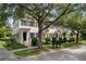 Charming townhomes with manicured lawns and mature trees under a blue sky at 4709 Fox St, Orlando, FL 32814