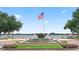 Picturesque fountain with American flag waving, set against a tranquil lake backdrop at 4709 Fox St, Orlando, FL 32814