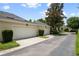 Attached two-car garage with white doors and well-maintained landscaping at 4709 Fox St, Orlando, FL 32814