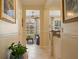 View through the hallway of the home towards the living room; natural light and tile flooring at 4709 Fox St, Orlando, FL 32814